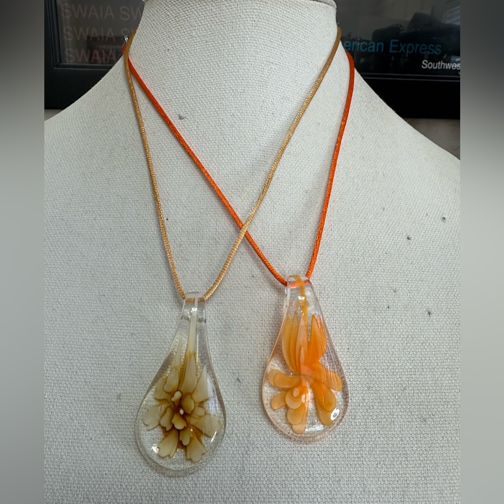 Two tear drop glass flower necklaces on satin cord